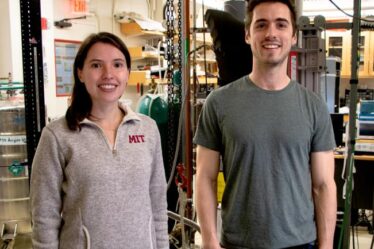 MIT physics graduate student Dahlia Klein (left) and postdoc David MacNeill pose in lab