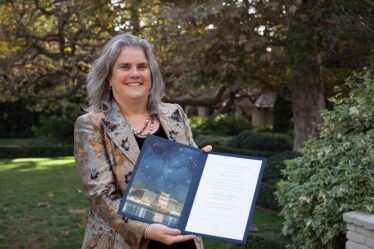 Andrea Ghez '87 poses with her Nobel diploma