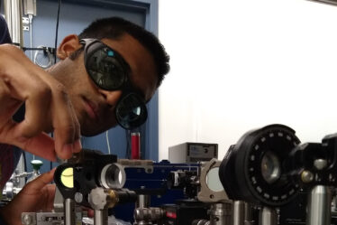 Sahil Pontula adjusts lens of experiment