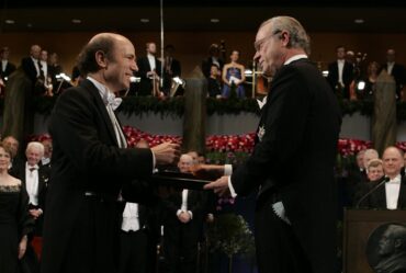 Frank Wilczek shakes hands with the King of Sweden while receiving the 2004 Nobel Prize in Physics